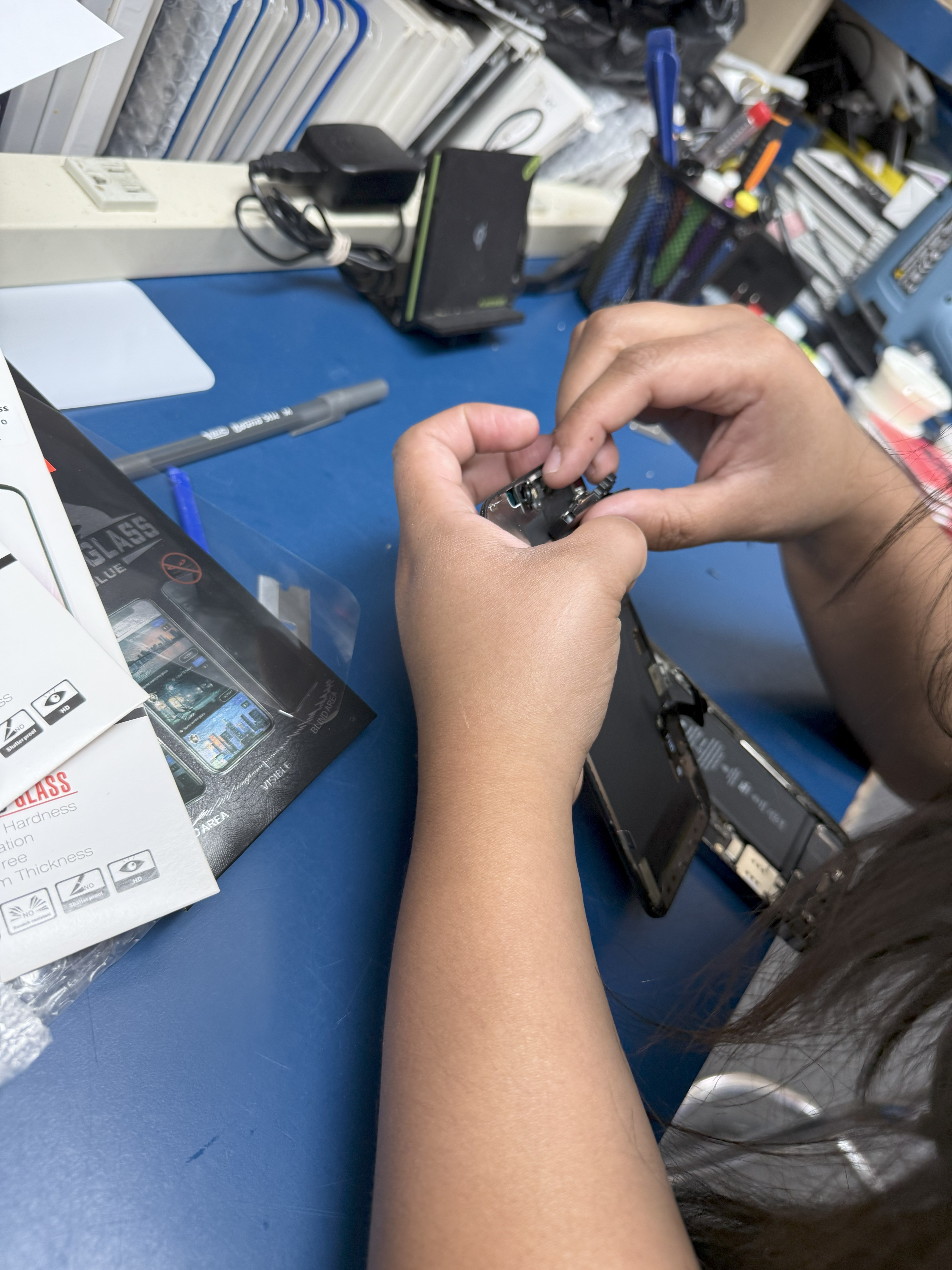 Technician fixing phone